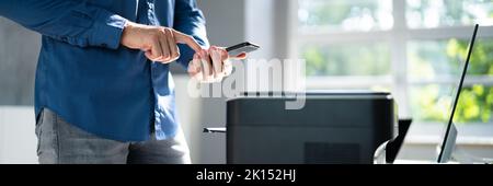 Wireless Print On Printer Using Mobile Phone Stock Photo