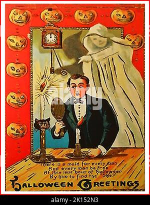 An old Halloween greetings card featuring a  ghost and a magic mirror which was supposed to reveal the face of the person someone would marry, if looked at during the final hour of Halloween Stock Photo