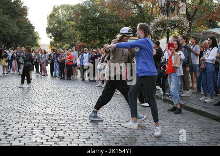 Odessa, Ukraine. 15th Sep, 2022. People are seen dancing to a street music band. Despite the full-scale invasion of the Russian Federation, on the weekends, joy and life reign on the main street of Odessa - Deribasovskaya, vacationers walk, dance, having fun, as in peacetime. Deribasovskaya street - one of the central streets of the city of Odessa, is one of the main attractions of the city.Since the end of the 20th century, most of Deribasovskaya has been closed to traffic and is a pedestrian zone. Deribasovskaya is a popular place for festivities. There are numerous cafes and shops on D Stock Photo