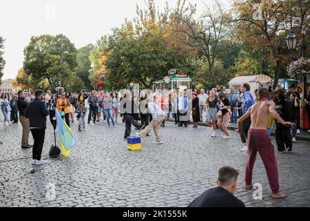 Odessa, Ukraine. 15th Sep, 2022. People are seen dancing to a street music band. Despite the full-scale invasion of the Russian Federation, on the weekends, joy and life reign on the main street of Odessa - Deribasovskaya, vacationers walk, dance, having fun, as in peacetime. Deribasovskaya street - one of the central streets of the city of Odessa, is one of the main attractions of the city.Since the end of the 20th century, most of Deribasovskaya has been closed to traffic and is a pedestrian zone. Deribasovskaya is a popular place for festivities. There are numerous cafes and shops on D Stock Photo