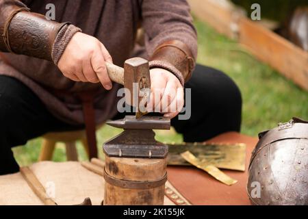 Close up of man's hands of a medieval blacksmith re-enactment of 4th Century Roman life during the 'Serdica is my Rome' heritage festival in Sofia, EU Stock Photo