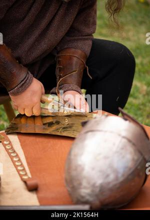 Close up of man's hands of a medieval blacksmith reenactment of 4th Century Roman life during the 'Serdica is my Rome' heritage festival in Sofia, Bulgaria, Eastern Europe, Balkans, EU Stock Photo