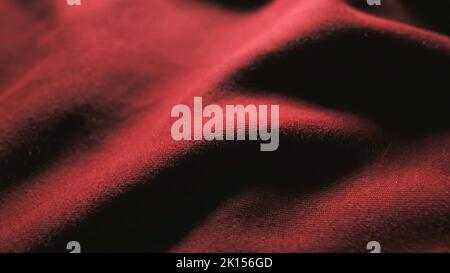Fragment of red tissue. Can be used as a background. Stock Photo