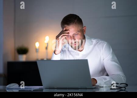 Stressful Business Man Working Late On Laptop In Office Stock Photo