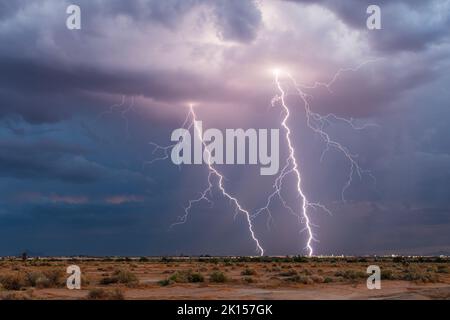 Dramatic lightning bolt strike in a thunderstorm over Casa Grande, Arizona Stock Photo