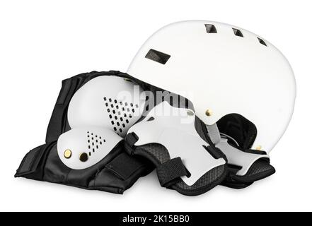 White black skateboard or inlane skating saftey equipment like skate helmet wrist knee and elbow protector pads on isolated background with clipping p Stock Photo