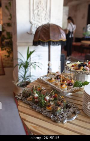 various snacks and drinks on the table at the event. Stock Photo