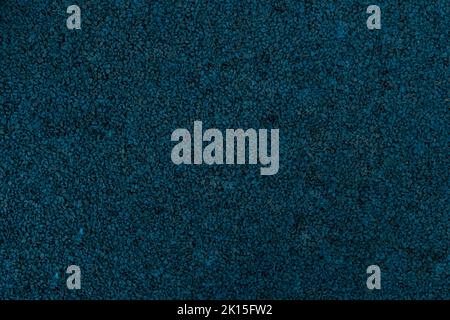 Dark blue texture of rubber crumb.Rubber asphalt. Copy space. A great background for your design. Stock Photo