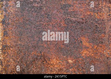 Dark light red rusty metal plate. Grunge texture. Rusty metal background. Rusty orange texture. Rust. Stock Photo