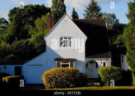 North-facing house in very early morning sunshine in mid summer Stock Photo