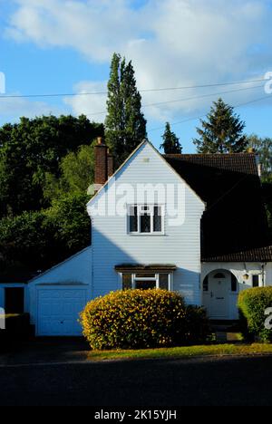 North-facing house in very early morning sunshine in mid summer Stock Photo