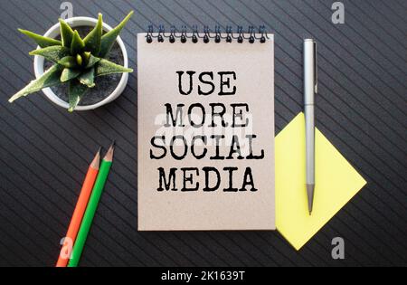 Retro effect and toned image of a woman hand writing a note with a fountain pen on a notebook. Stock Photo