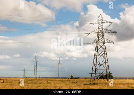 Electricity pylon and wind turbine, Scotland, UK 2022 Stock Photo