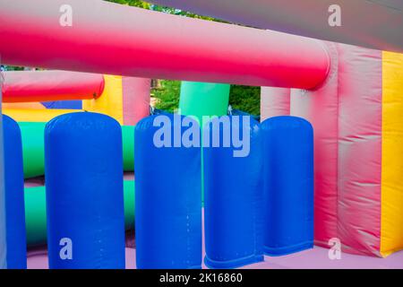 Detail of a brightly colored bouncy castle, empty without children. Stock Photo