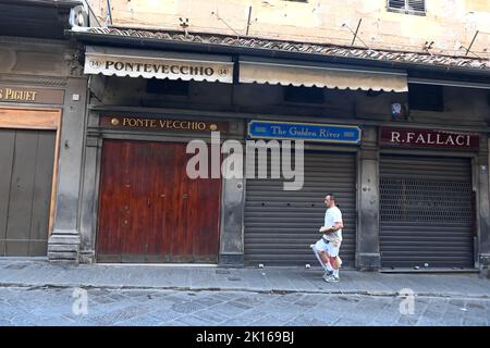 Ponte Vecchio bridge Florence Italy - colorful shops on famous landmark Stock Photo