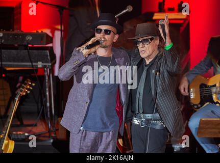 Hamburg, Germany. 15th Sep, 2022. Musicians Jan Delay (l) and Udo Lindenberg, and band stand during the 'Get Back To Audimax!' - Show on stage at the university's Audimax. Fifty years after Otto's legendary concert at the university's Audimax, Hamburg musicians presented a public series on the Hanseatic city's musical history. Credit: Georg Wendt/dpa/Alamy Live News Stock Photo