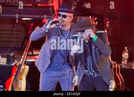 Hamburg, Germany. 15th Sep, 2022. Musicians Jan Delay (l) and Udo Lindenberg, and band stand during the 'Get Back To Audimax!' - Show on stage at the university's Audimax. Fifty years after Otto's legendary concert at the university's Audimax, Hamburg musicians presented a public series on the Hanseatic city's musical history. Credit: Georg Wendt/dpa/Alamy Live News Stock Photo