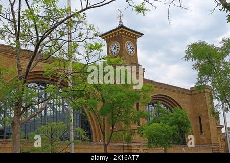 Kings cross railway station with trees, clocktower,  terminus for East Coast Mainline LNER, Euston Rd, London , England, UK, N1 9AL Stock Photo