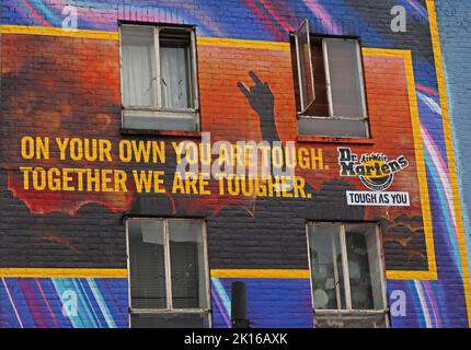 On your own you are tough - Together we are tougher. Dr Martens building mural art, on a shop in Camden High Street,Camden Town, London,England,UK,NW1 Stock Photo