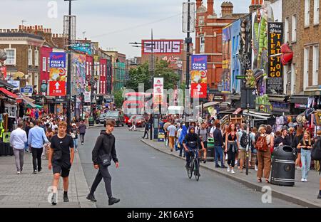 Shops with tourists & shoppers, in Camden High Street, Camden Town, London, England, UK, NW1 8QR Stock Photo
