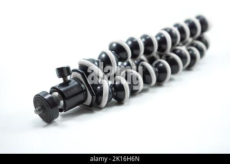 gorilla pod isolated on white background - smartphone tripod - tripod flexible - tripod octopus Stock Photo