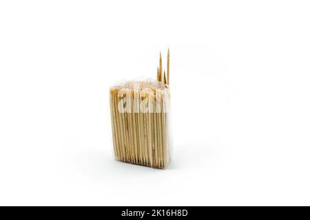 toothpick made of wood wrapped in plastic isolated on a white background Stock Photo