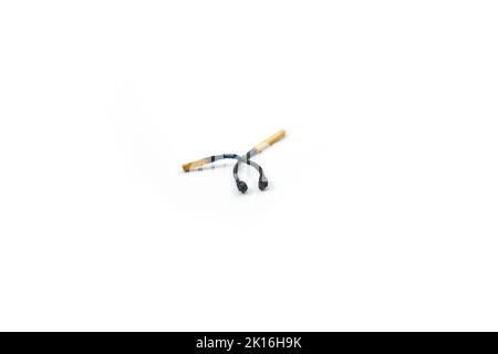 a pair of matches that burned out isolated on a white background Stock Photo