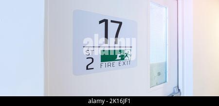 Fire Exit door sign for emergency. Stairwell fire for escape in building or apartment Stock Photo