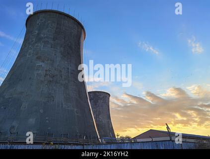 Industrial chimney made of concrete blocks. Concept of preserving the environment and taking care of nature Stock Photo
