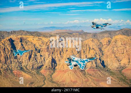 September 11, 2022 - Nellis Air Force Base, Nevada, USA - Three F-16 Fighting Falcons assigned to the 64th Aggressor Squadron perform a flyover above Las Vegas, Nevada, in honor of 9/11 on Septembert. 11, 2022. The flyover was dedicated to the 2,977 people who lost their lives on Septembert. 11, 2001 and to the more than 6,000 others who were injured. (Credit Image: © U.S. Air Force/ZUMA Press Wire Service/ZUMAPRESS.com) Stock Photo