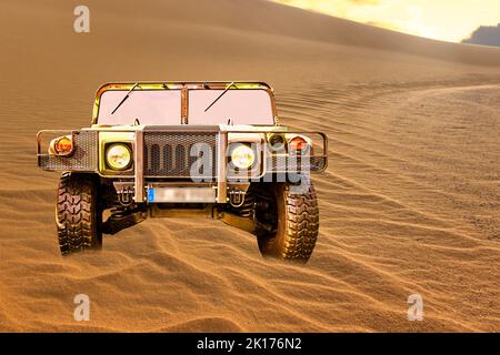 Humvee H1 military vehicle in camouflage on a dune in the sand of the desert, vehicle location Lehnin, Germany, September 11, 2022. Stock Photo