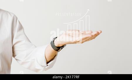 Digital increasing bar graph with businessman hand overlay Stock Photo