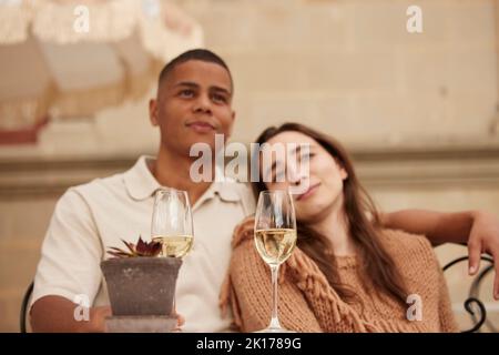 Couple celebrating on patio Stock Photo