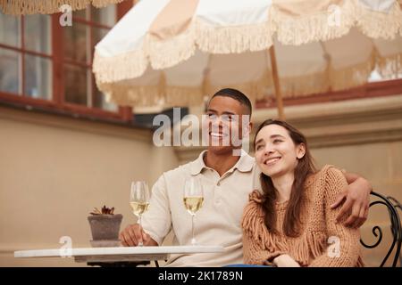 Couple celebrating on patio Stock Photo