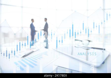 Close-up of business objects at workplace on background of office workers interacting Stock Photo