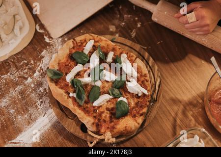 High angle view of pizza on wooden board Stock Photo
