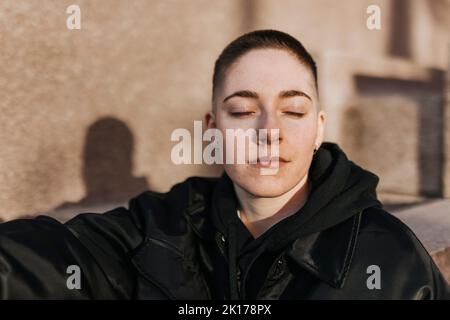 Young woman with eyes closed Stock Photo