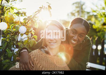 Female friends looking at camera Stock Photo