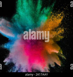 Explosion of colored powder on black background Stock Photo - Alamy