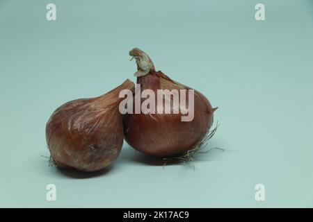 Group of red onions isolated on white background, closeup Stock Photo