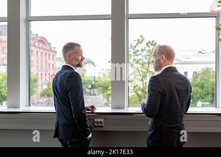 Businessmen talking during break Stock Photo