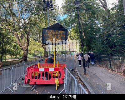 A sign outside Southwark Park in London announces that the queue to see the Queen has been paused as members of the public wait to view Queen Elizabeth II lying in state ahead of her funeral on Monday. Picture date: Friday September 16, 2022.