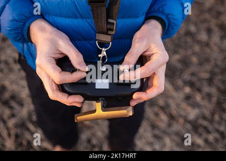 Person holding remote controller Stock Photo
