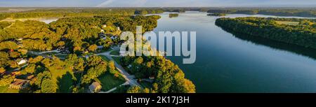 Aerial panorama view of lakefront and lake view homes, golf course and floating boat docks on Tims Ford Lake in Tennessee. Stock Photo