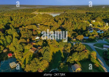 Aerial overhead view of lakefront and lake view homes and floating boat docks on Tims Ford Lake in Tennessee. Stock Photo