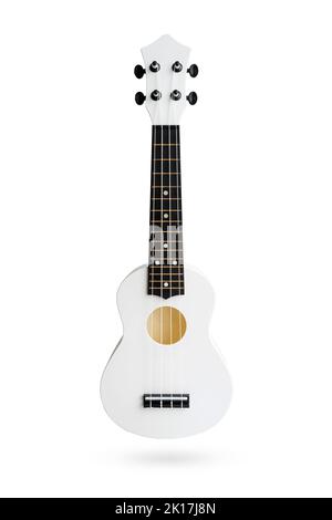 Small Hawaiian four stringed ukulele guitar isolated on white background with clipping path. Musical instruments shop or learning concept Stock Photo