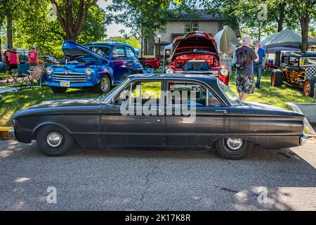 Falcon Heights, MN - June 18, 2022: High perspective side view of a 1960 Ford Falcon Fordor Sedan at a local car show. Stock Photo
