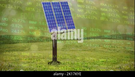 Image of financial data processing over solar panels in green field Stock Photo