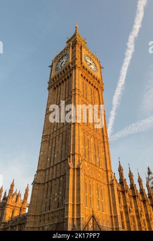 The 96m clock tower of Big Ben (the Elizabeth Tower), part of the Palace of Westminster, after its recent 4-year renovation, in late evening light Stock Photo