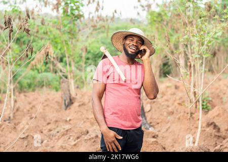 african farmer making a phone call Stock Photo